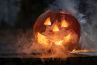 a pumpkin with smoke